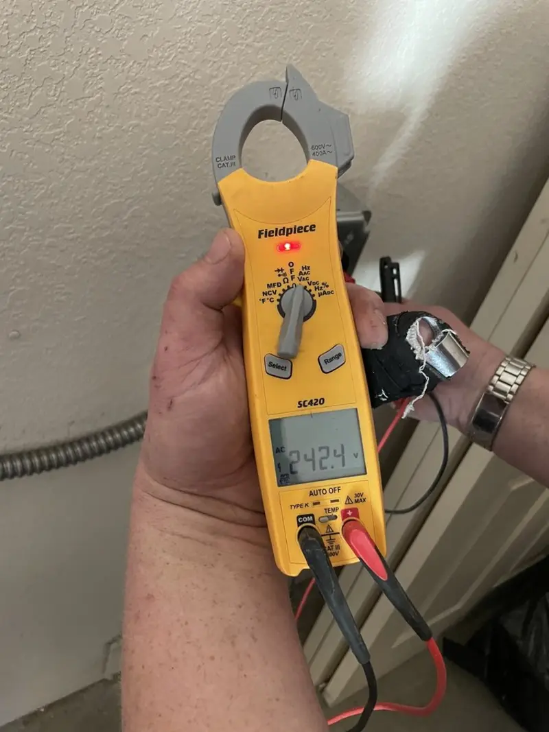 Voltage testing with clamp meter during Electrical Installation Services in Buckley
